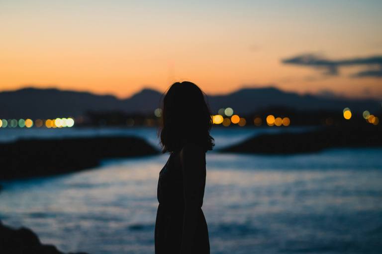 Single woman overlooking the city